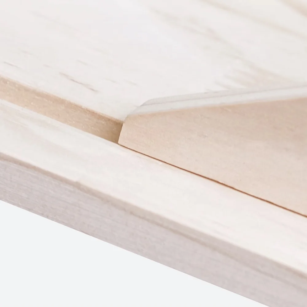 The canvas edge riding the smooth timber slide rail