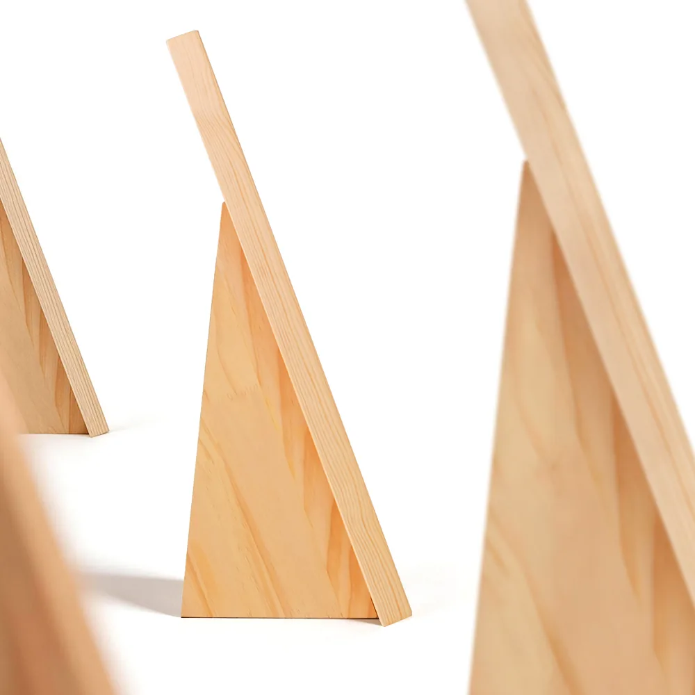 Three pine easel backs standing in a row