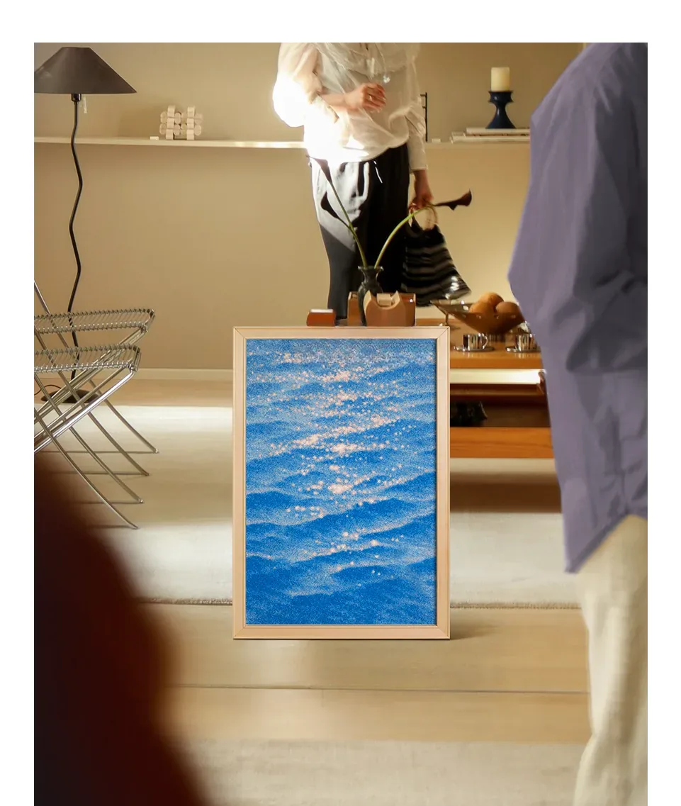 A couple cooking at home, the canvas leaning by the kitchen bench